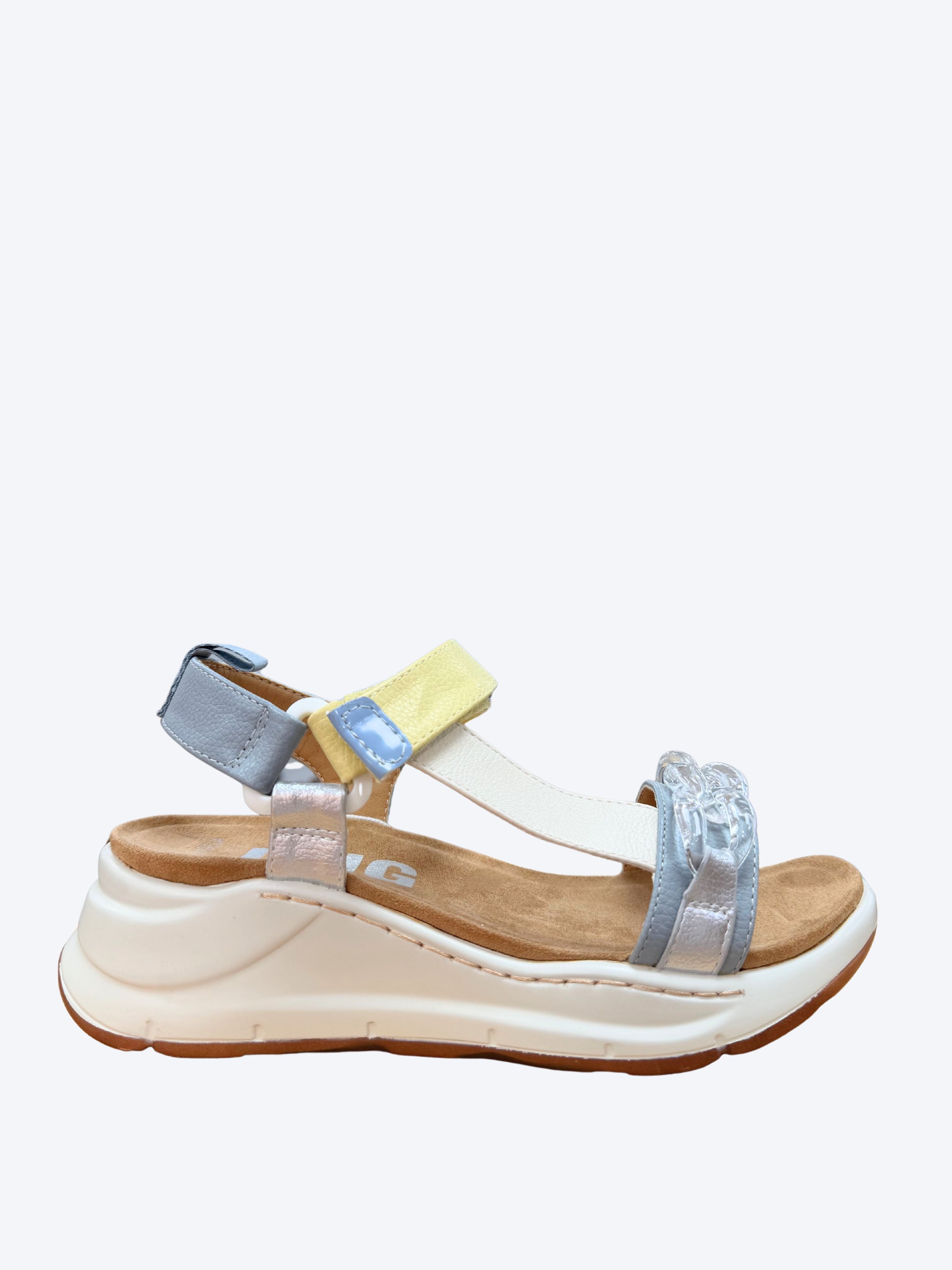 Sandalia deportiva mujer D'Angela en azul celeste, amarillo y plateado con detalle joya y suela cuña blanca, vista lateral